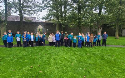 3rd Class and Junior Infants Buddy up for Autumn Scavenger hunt.